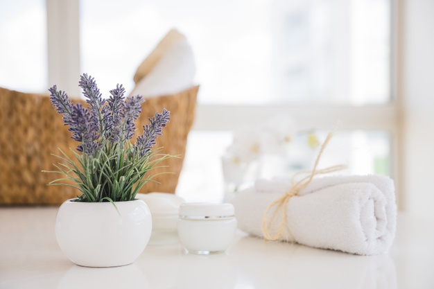 towel-lavender-flowers-white-table-with-cream_23-2148116093